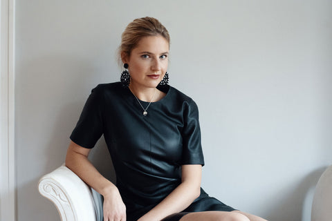 Handmade Jewelry - Woman with silhouette pendant on chair