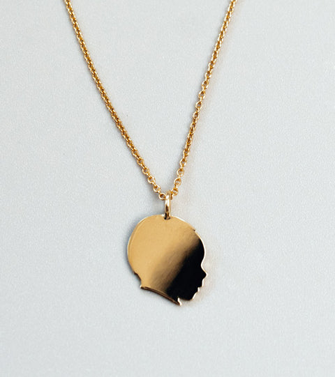 Handmade Jewelry - Golden silhouette pendant of a child